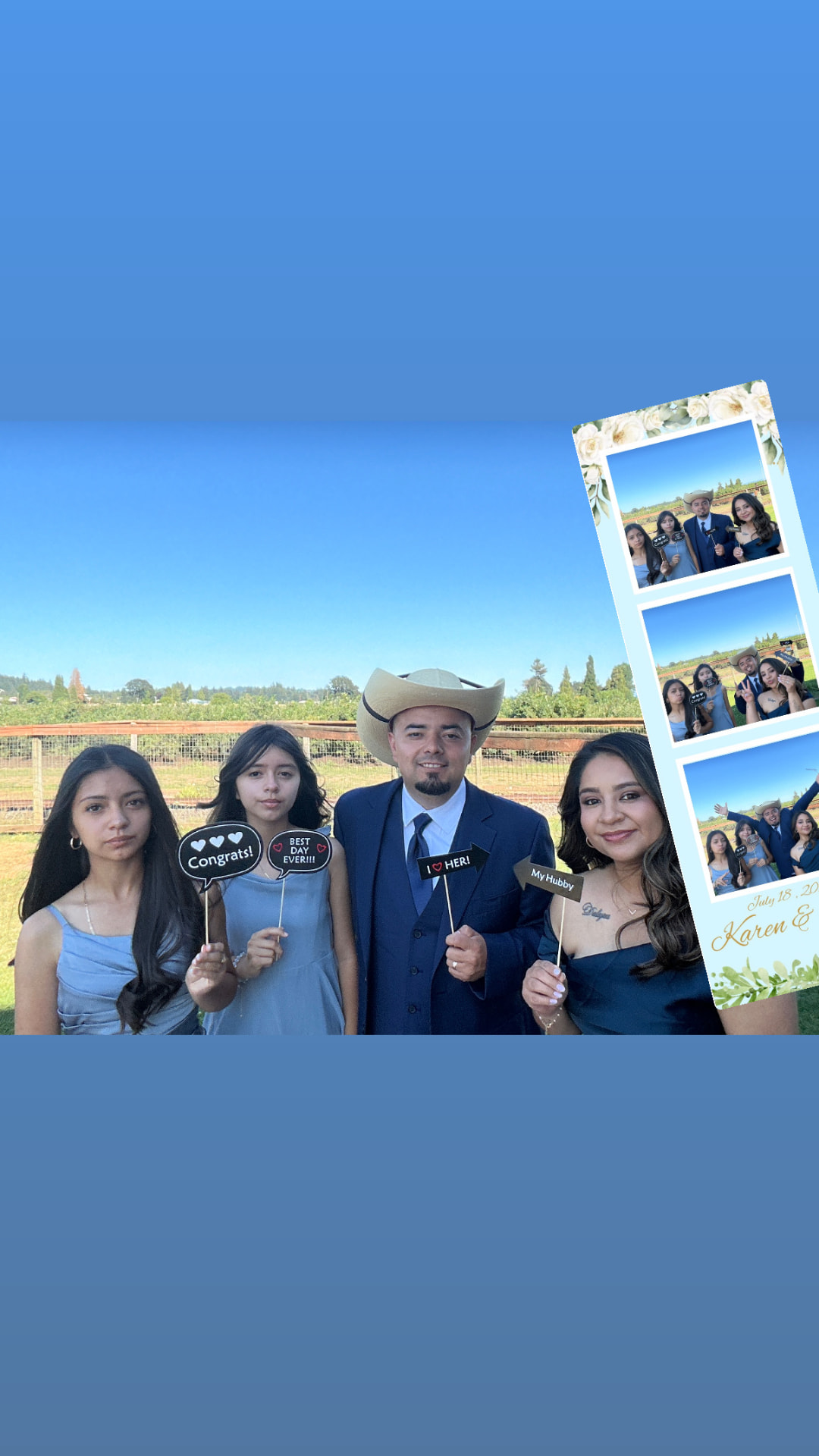 Family with sign props showing off their photo booth prints
